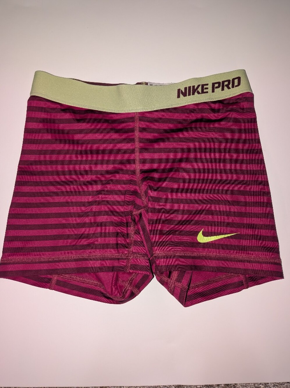Nike Pro Women's Burgundy and Dark Pink Striped Athletic Shorts with Lime Swoosh